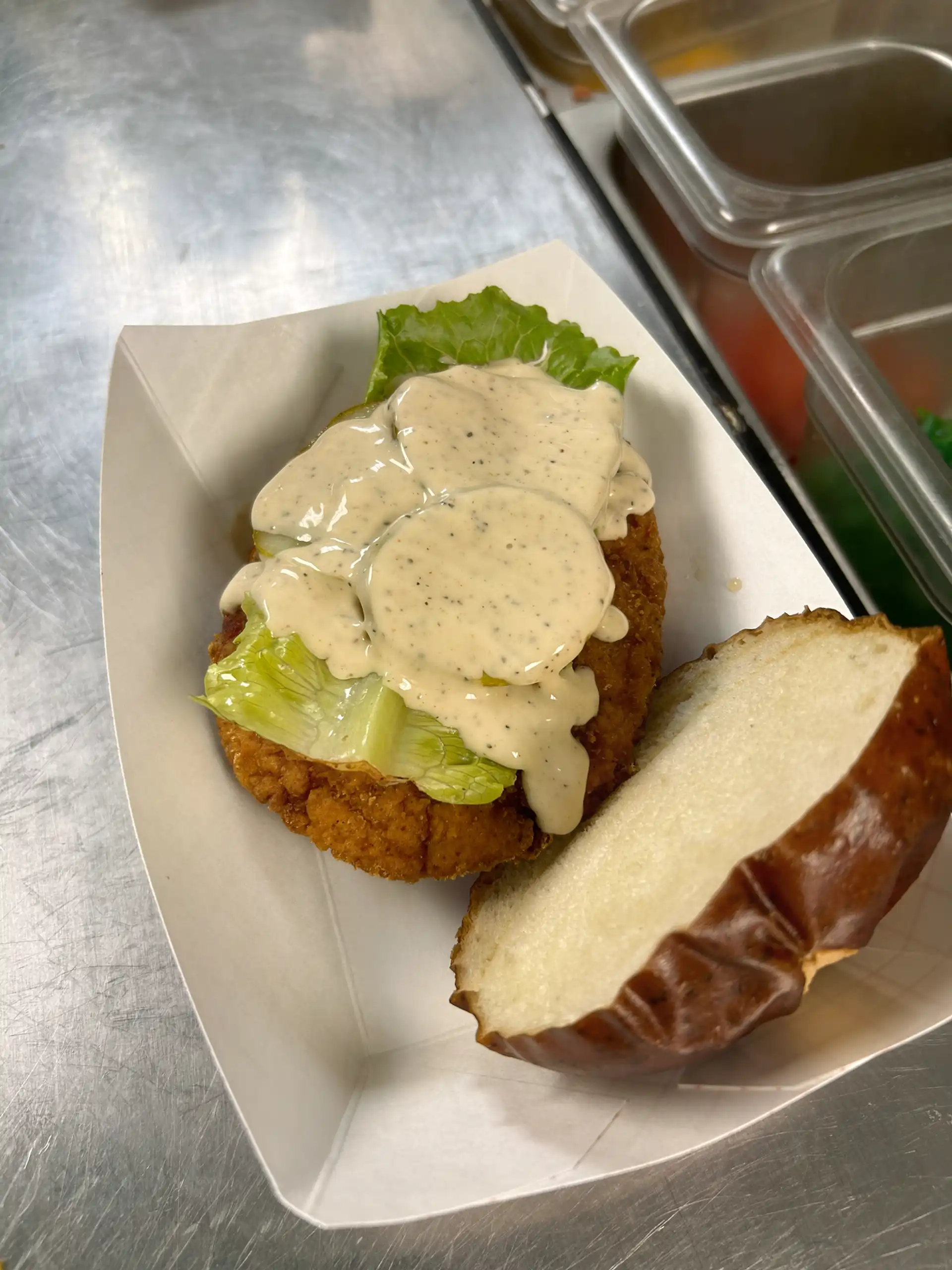 Fried 6 oz. Chicken Breast served on a Pretzel Bun, with Onion, Pickle, Lettuce, and House Made Alabama White Sauce