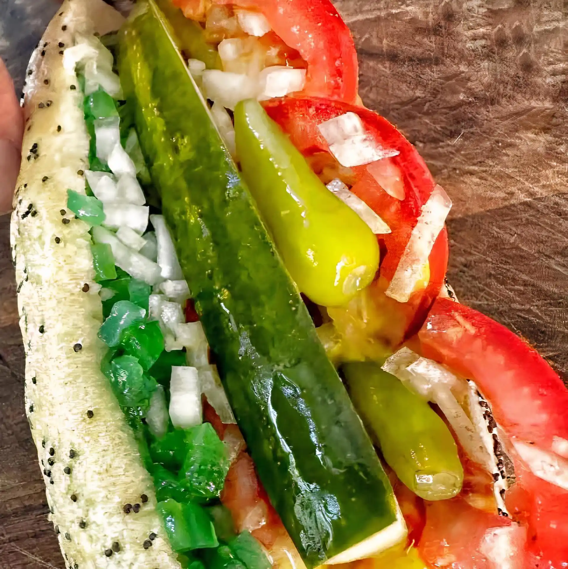 Wien on a Poppy Seed Bun with Mustard, Tomato, Pickle Spear, Green Relish, Onion, Sport Peppers, and Celery Salt