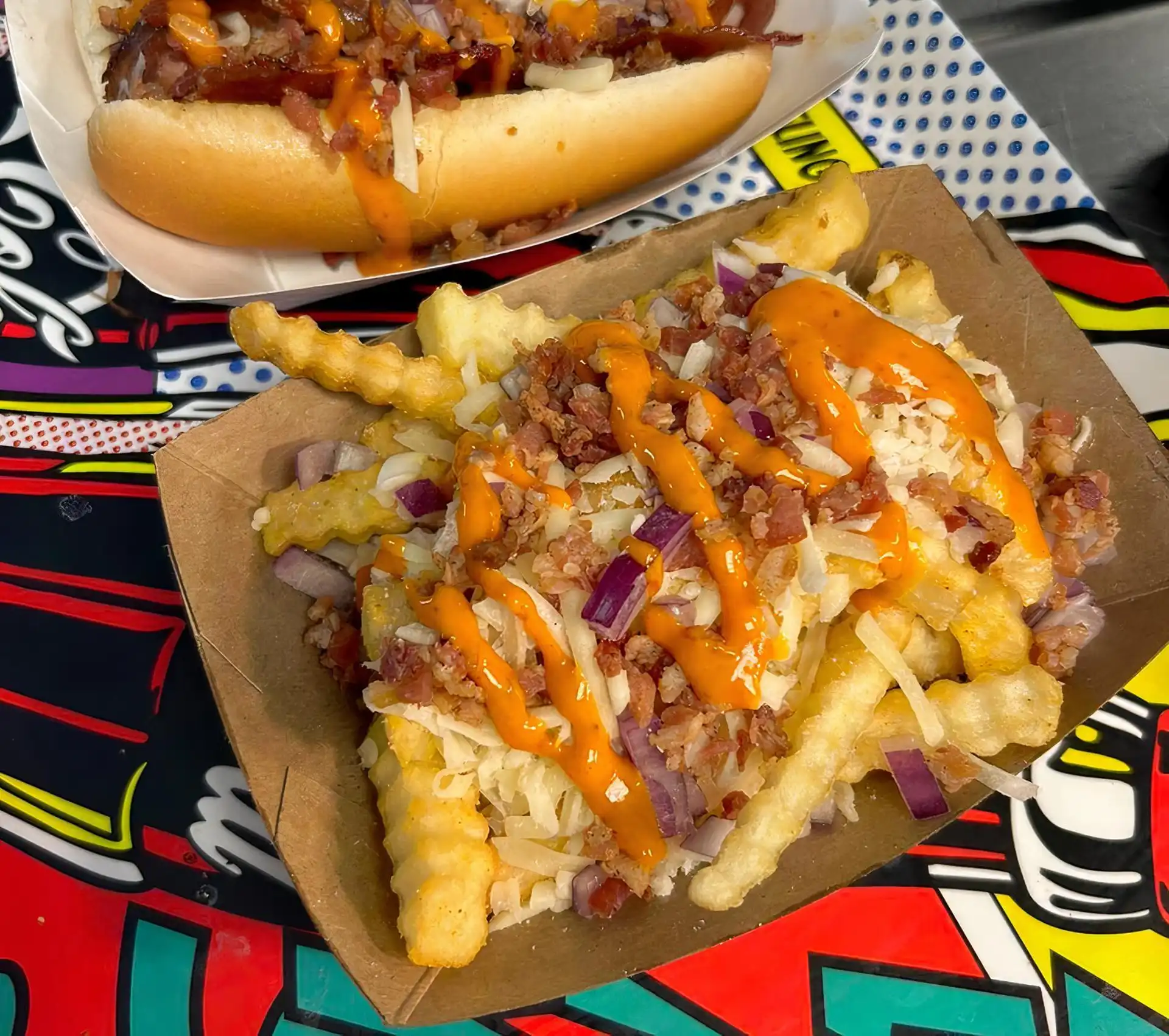 Crinkle Cut French Fries with Bacon Bits, Gruyere Cheese, Red Onion and Truffle Sauce