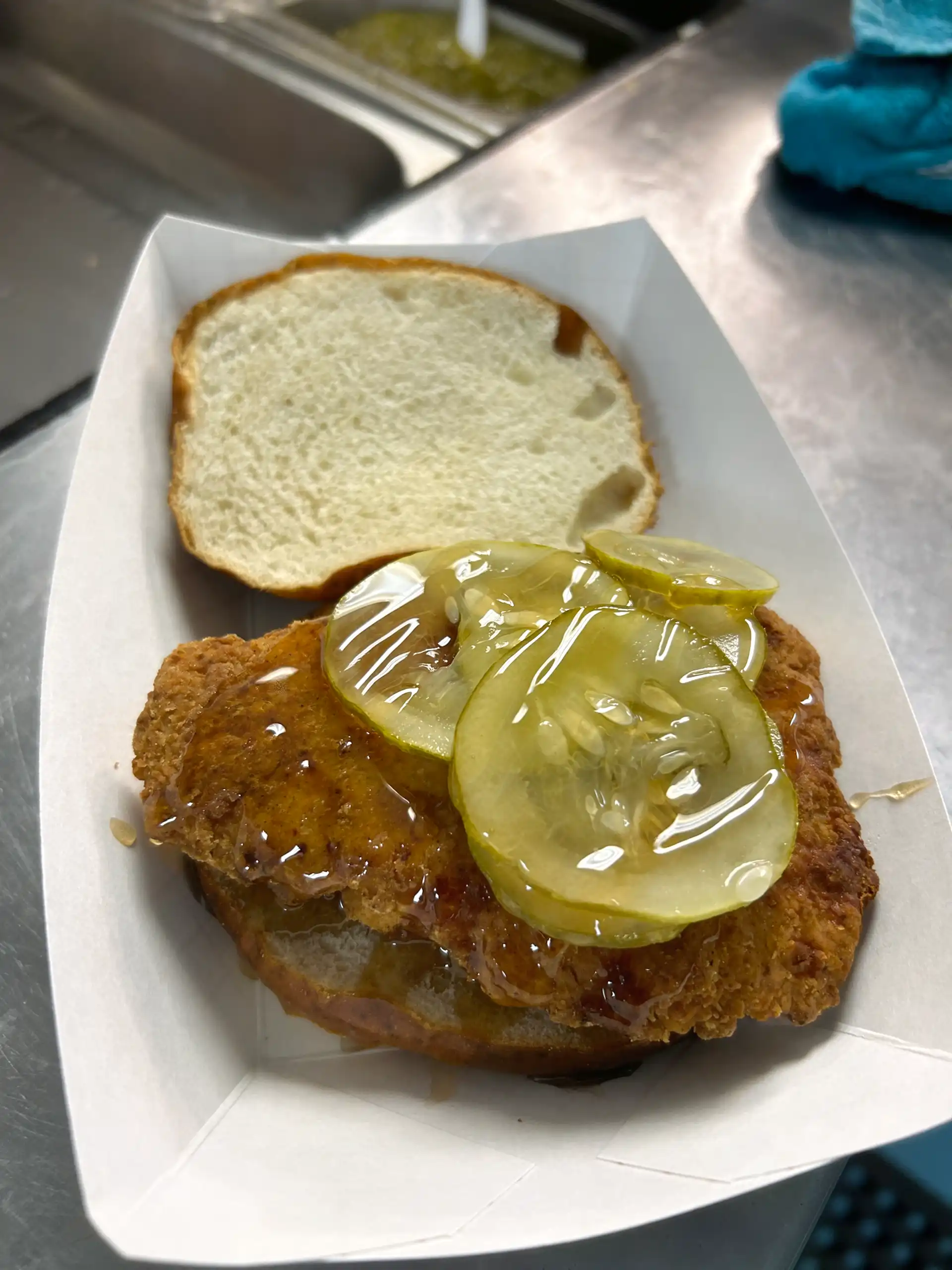Fried 6 oz. Chicken Breast served on a Pretzel Bun, with Onion, Pickle, House Made Hot Honey