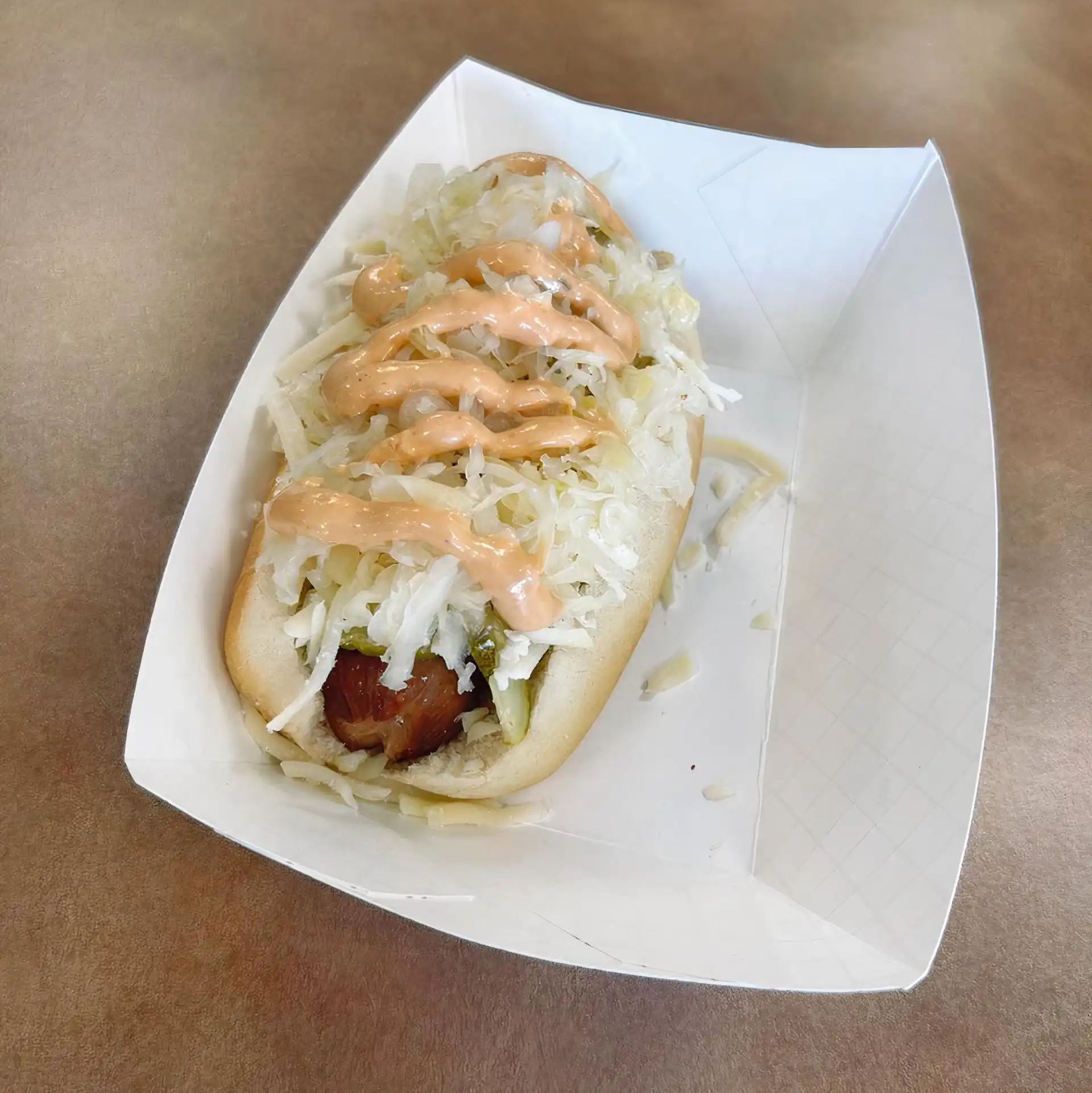 Smoked 1/4 lb. Wien with Pickle Slices, Sauerkraut, Swiss Cheese, and 1000 island dressing