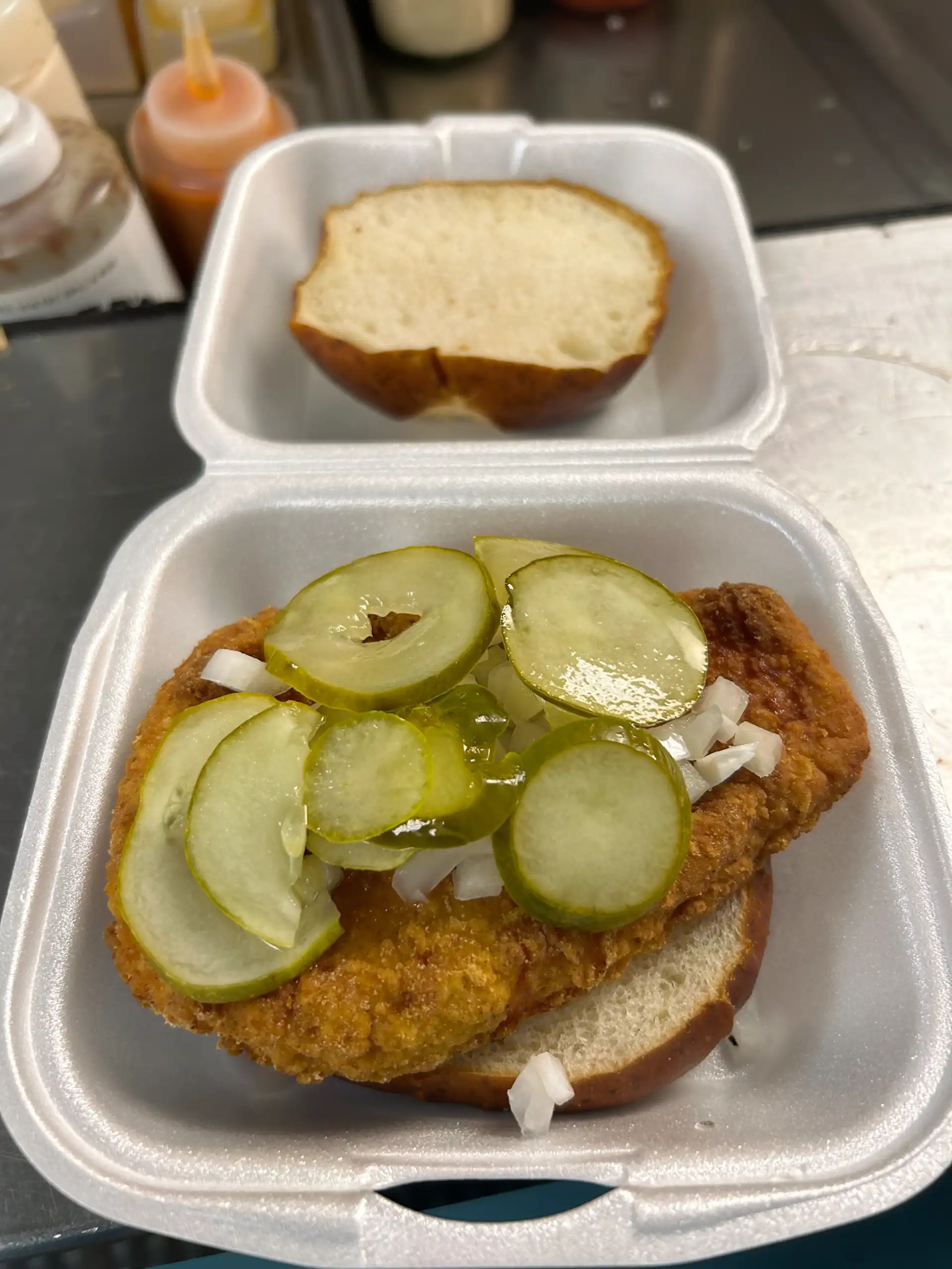 Fried 6 oz. Chicken Breast served on a Pretzel Bun with Onion and Pickle