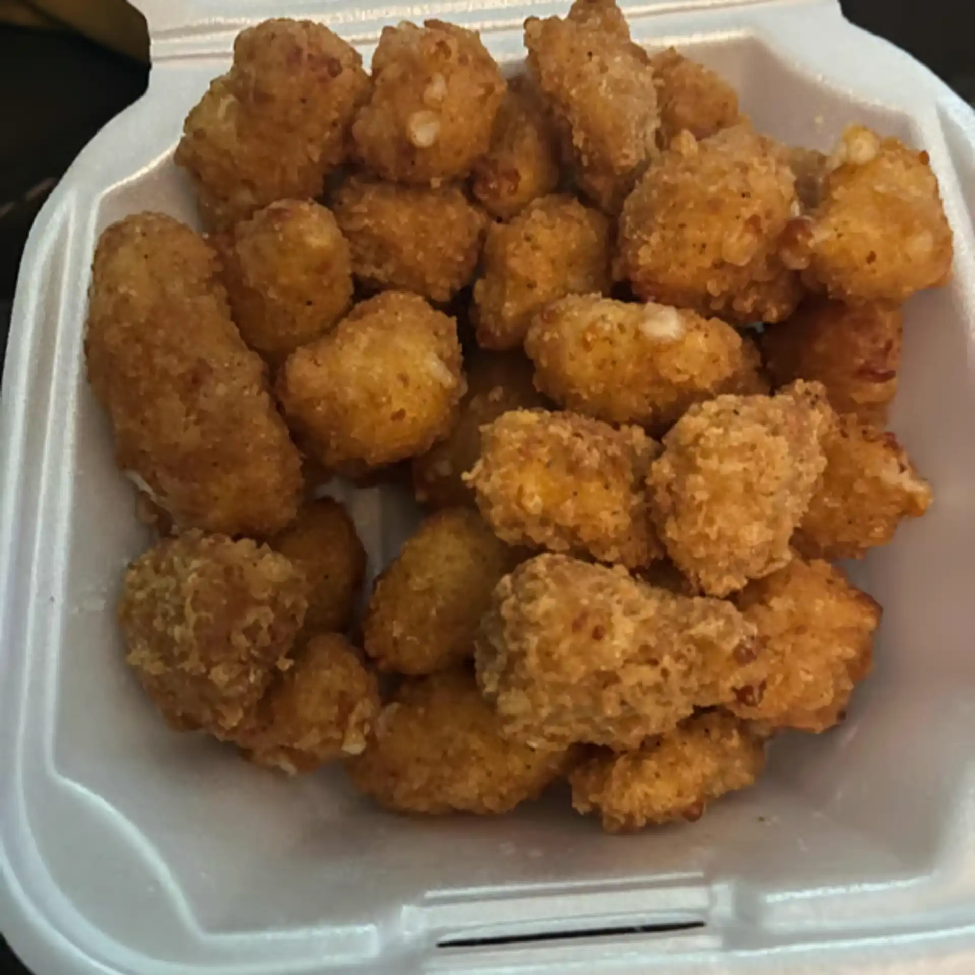 Wisconsin cheese curds with a spicy breading deep fried to perfection